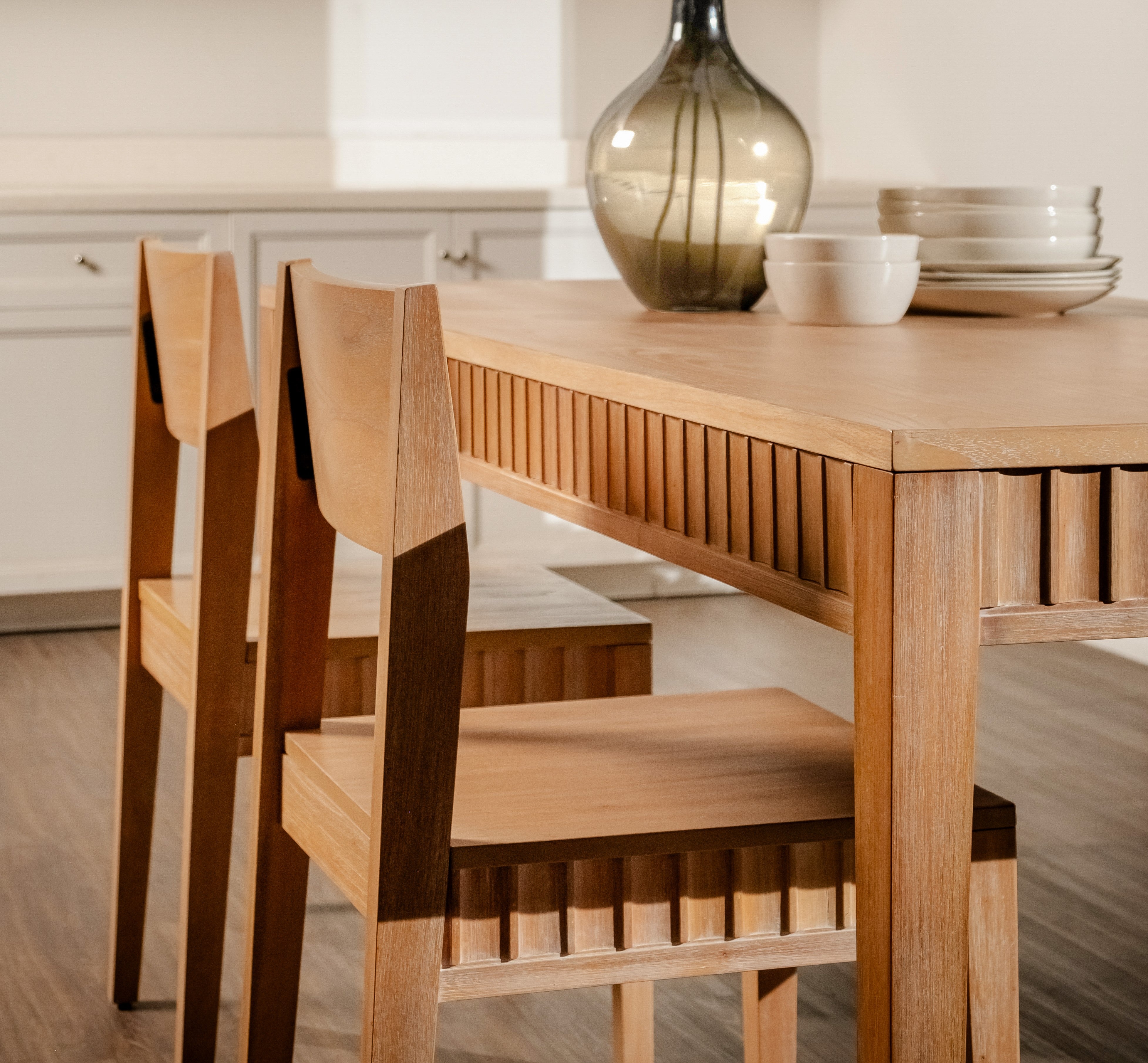 Wooden dining table and chairs in a kitchen setting