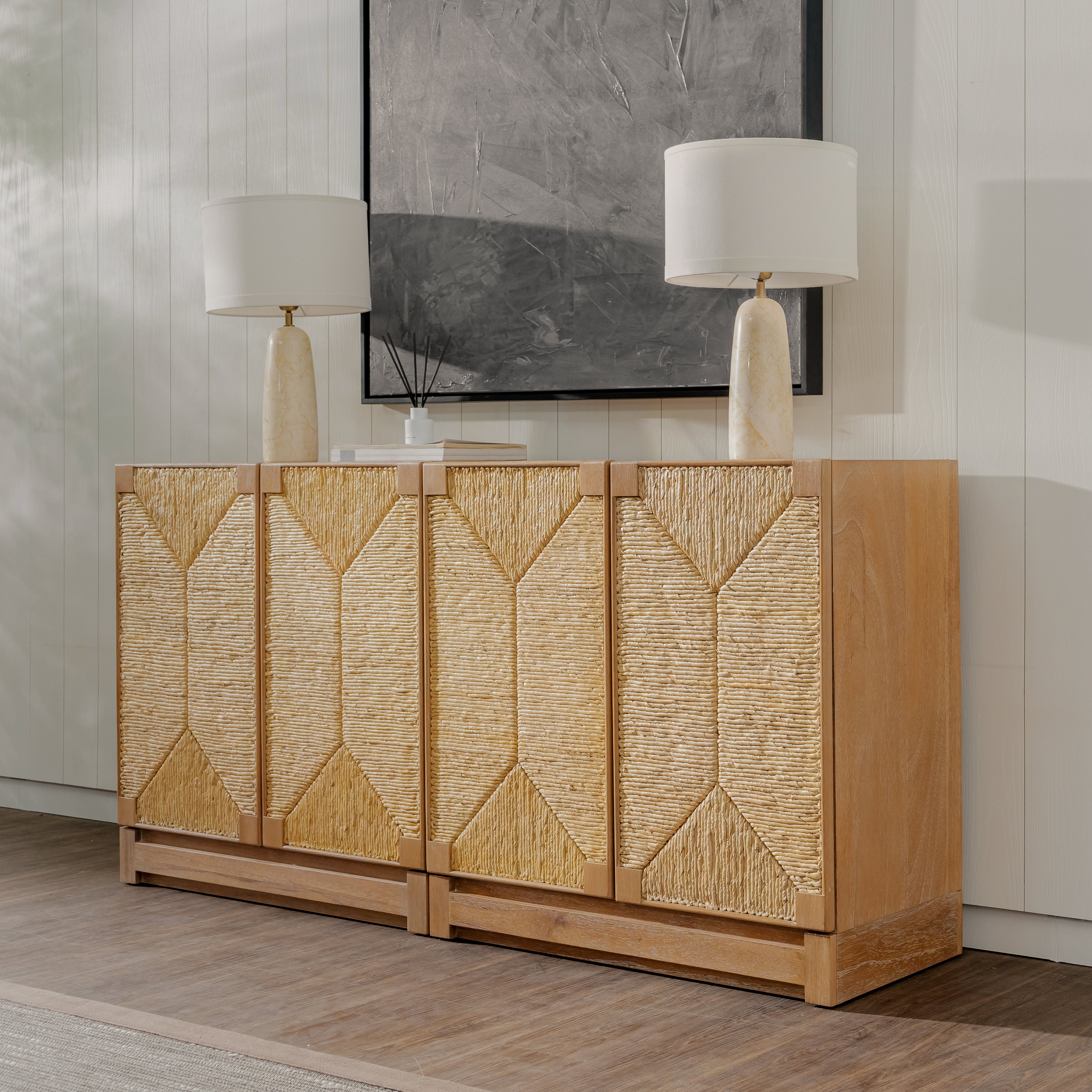 Wooden sideboard with geometric pattern in a room with lamps and abstract art.