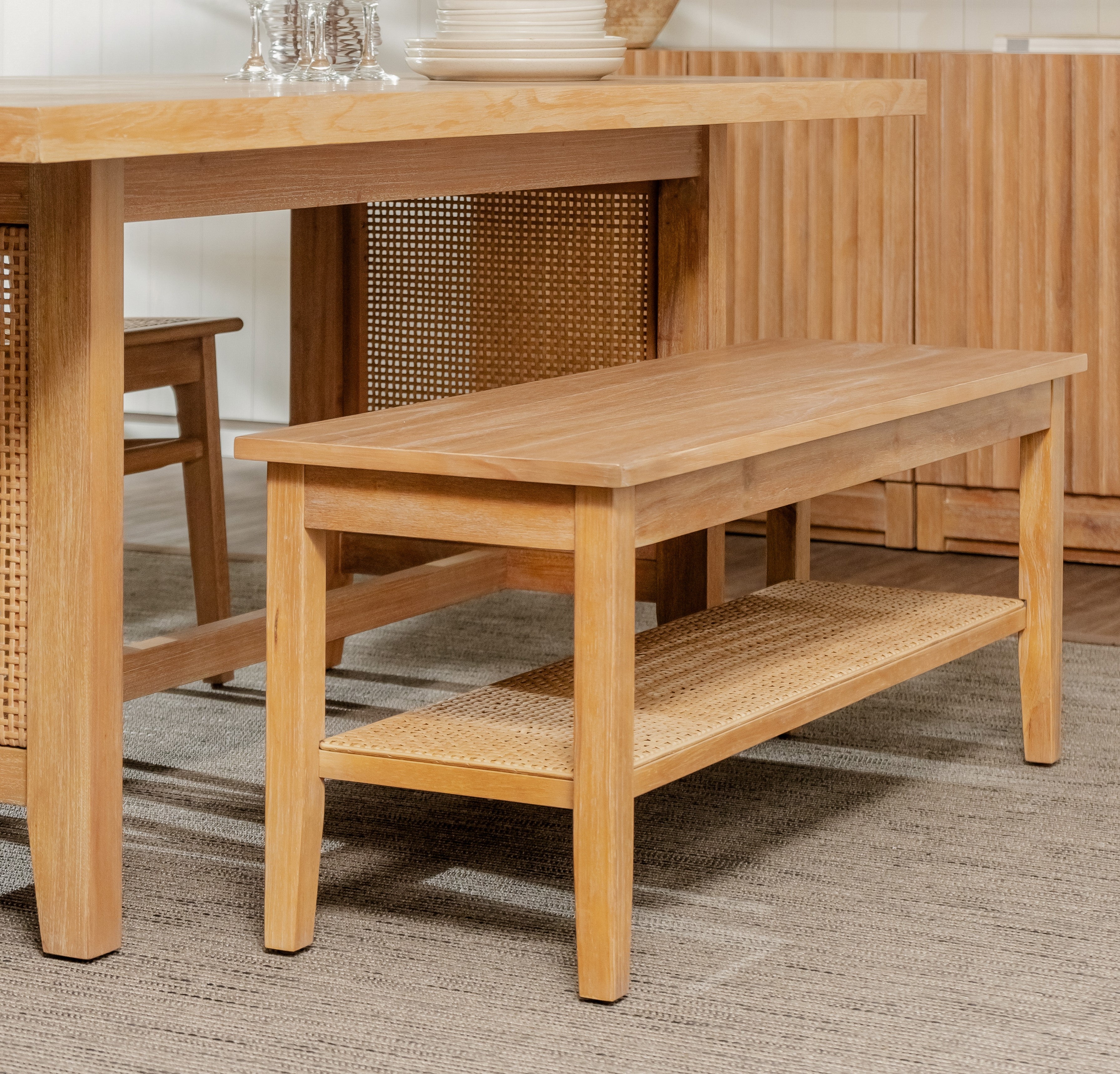 Wooden bench with woven shelf in a room setting