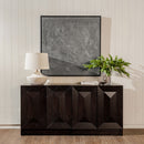 Black Averi Modular Cabinet with decorative items against a light wall.