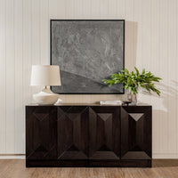 Black Averi Modular Cabinet with decorative items against a light wall.