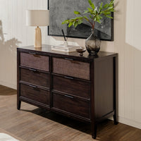Wooden dresser with wicker drawers in a room setting