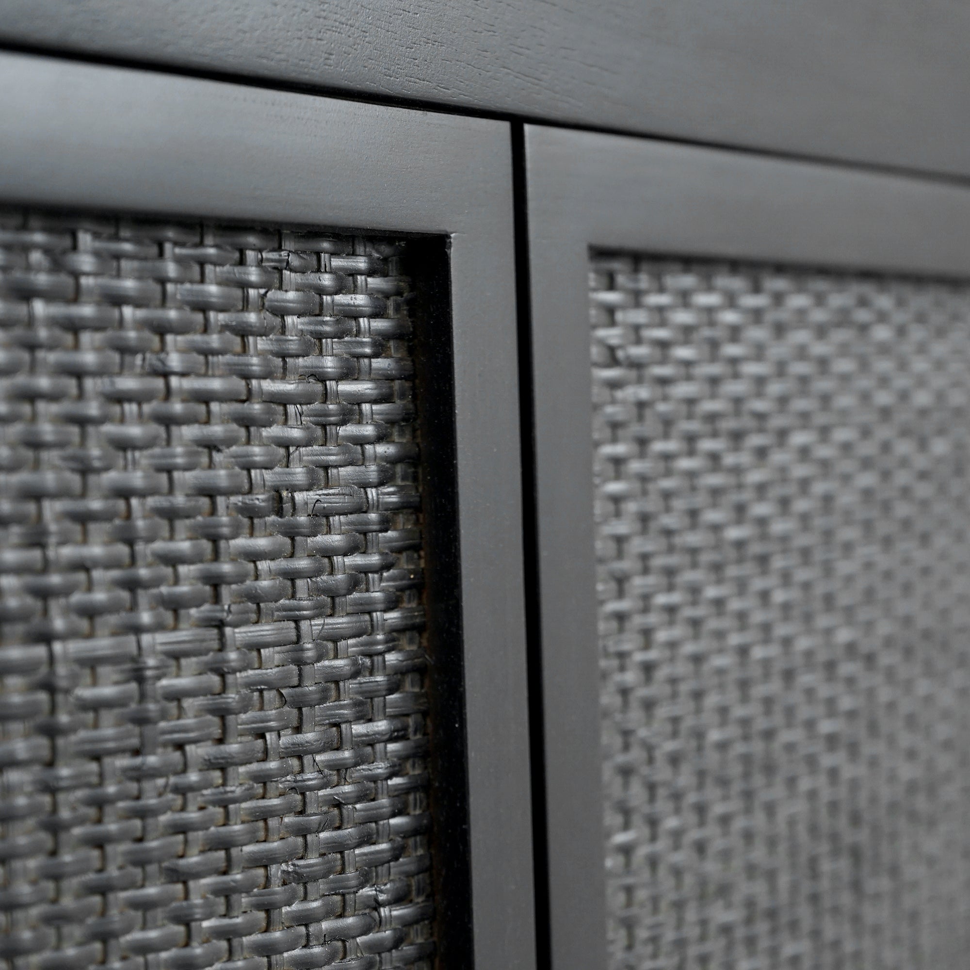 Close-up of Black Kalana Queen Rattan Bed detail footboard