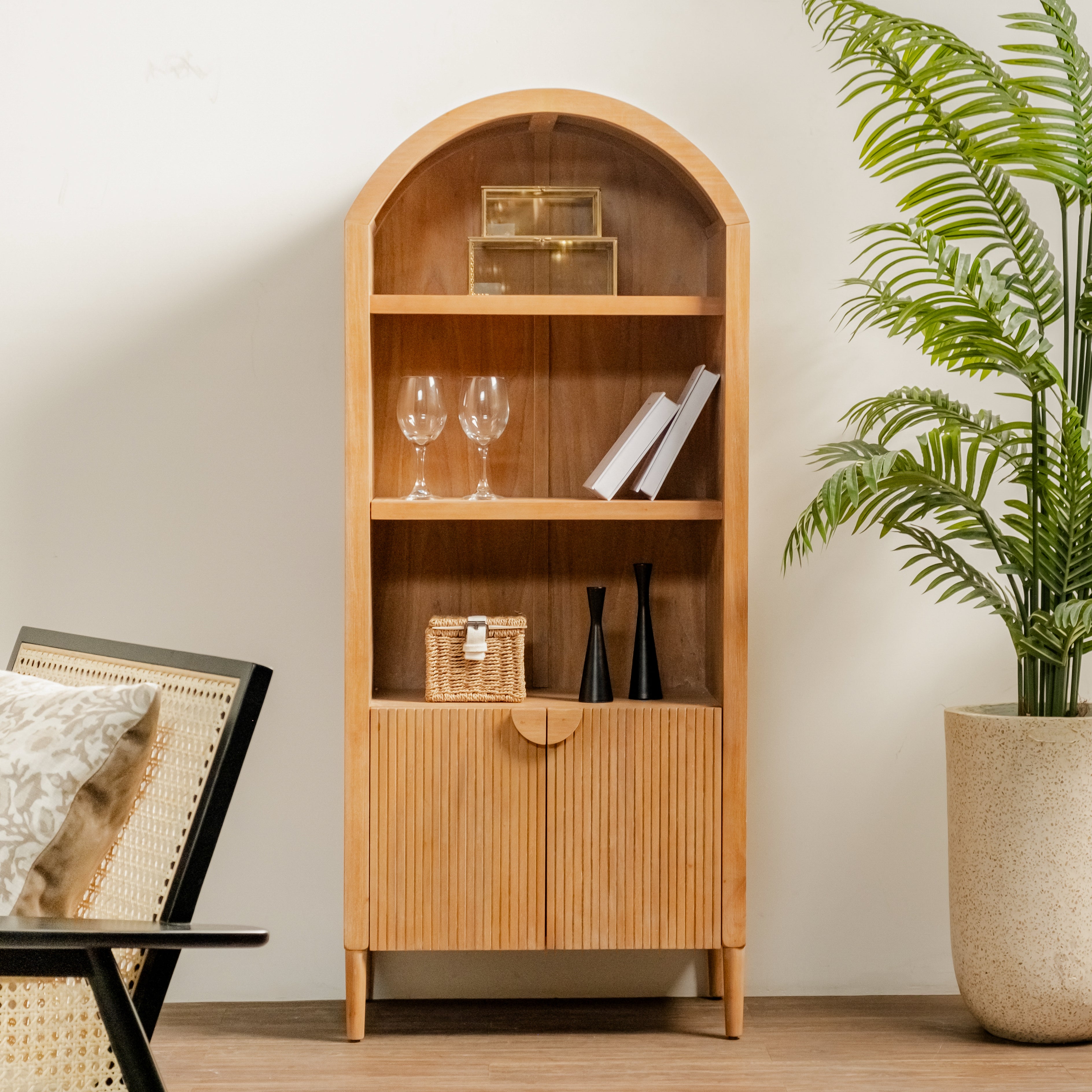 Javon Natural with decorative items in a room with a plant and chair.