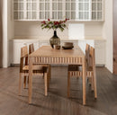 Dining area with wooden table and chairs in a kitchen setting