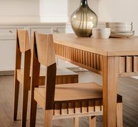 Wooden dining table and chairs in a kitchen setting